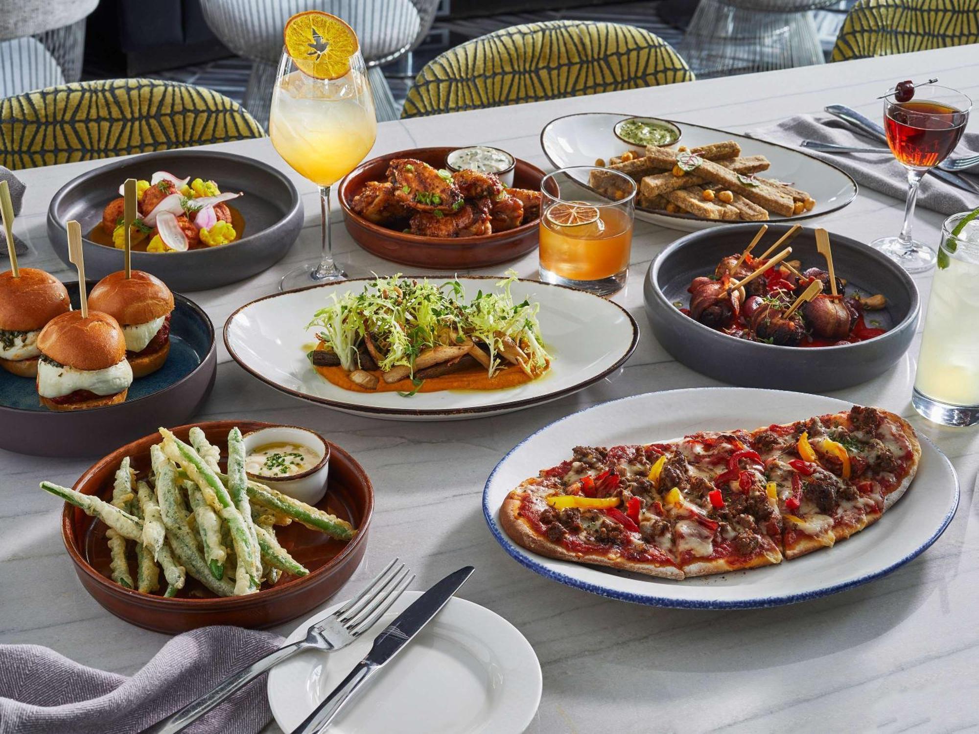 Sofitel Chicago Magnificent Mile Hotel Bagian luar foto A selection of dishes from the restaurant